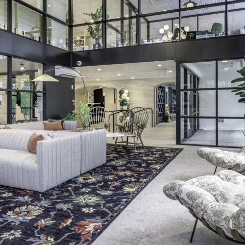 Stylish City Living lobby space with large ceilings and seating areas