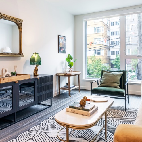 Welcome Home living room with large windows